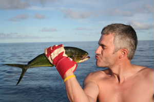 Charlie kissing a fish