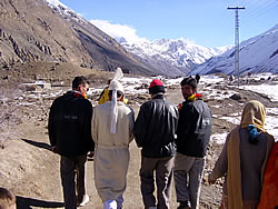 Riding high on the shoulder of the Pakistan-Afghan border, the groom walks towards his future bride to be.