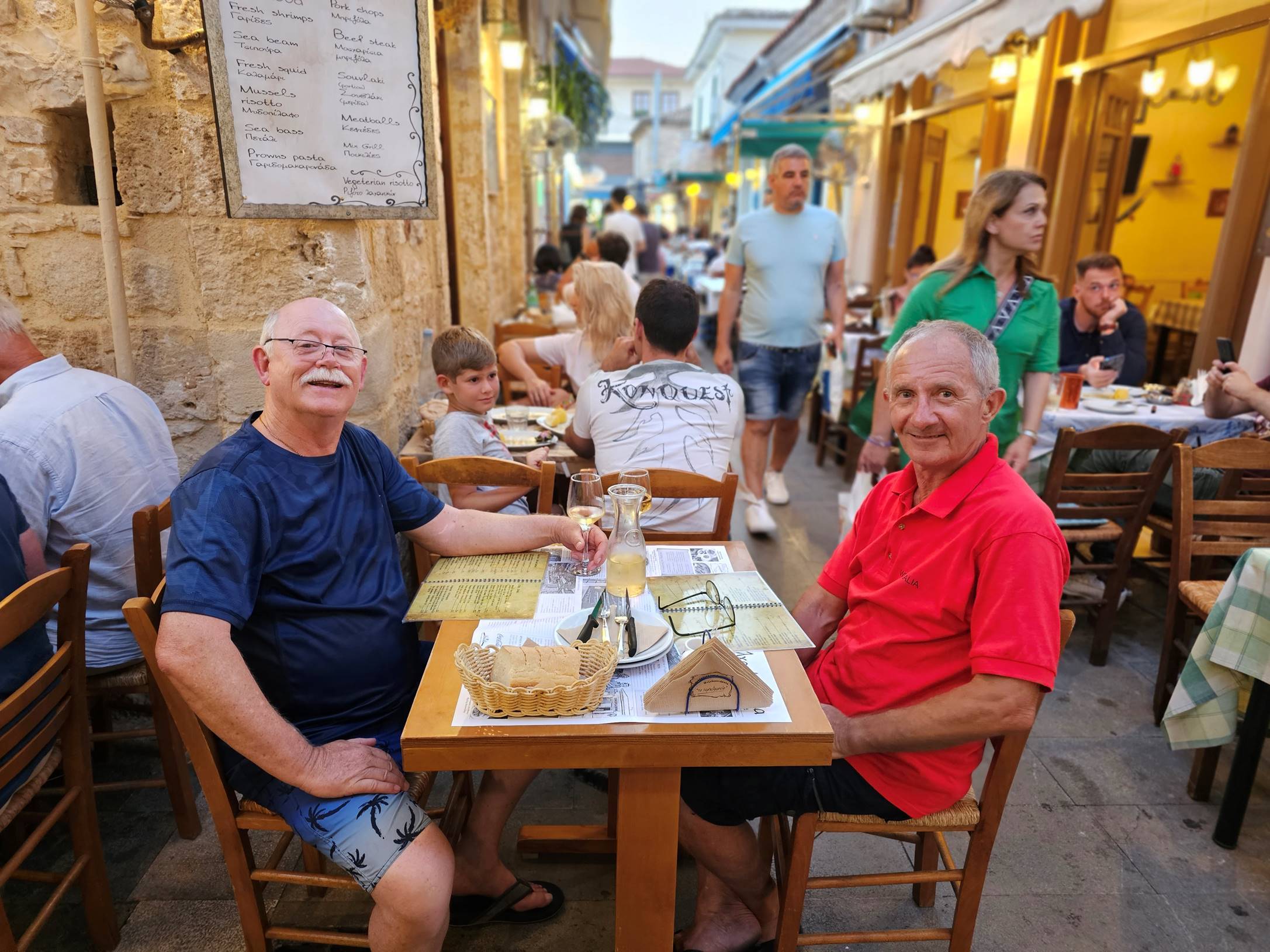 A group of people sitting at a table

Description automatically generated
