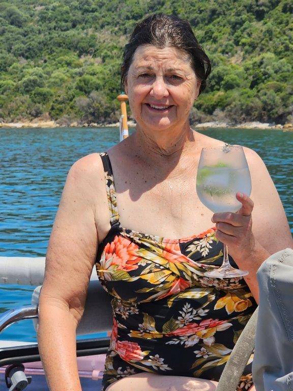 A person holding a wine glass

Description automatically generated