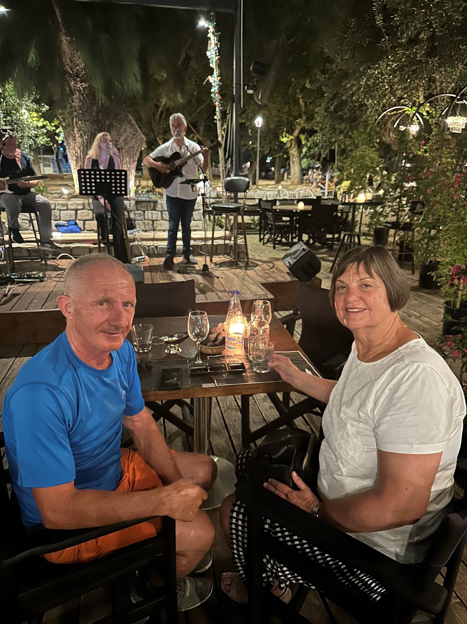 A person and person sitting at a table

Description automatically generated
