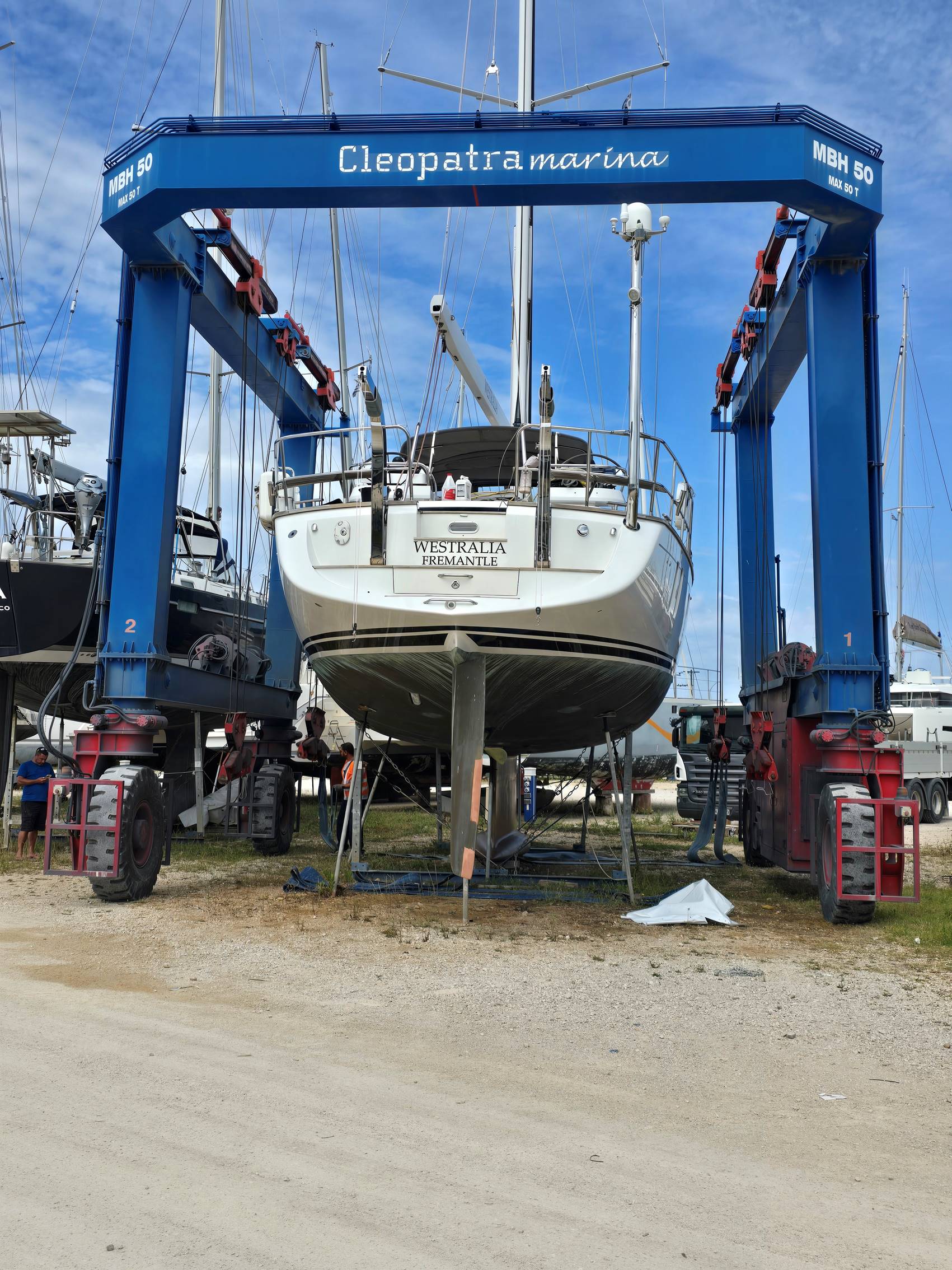 A boat in a yard

Description automatically generated
