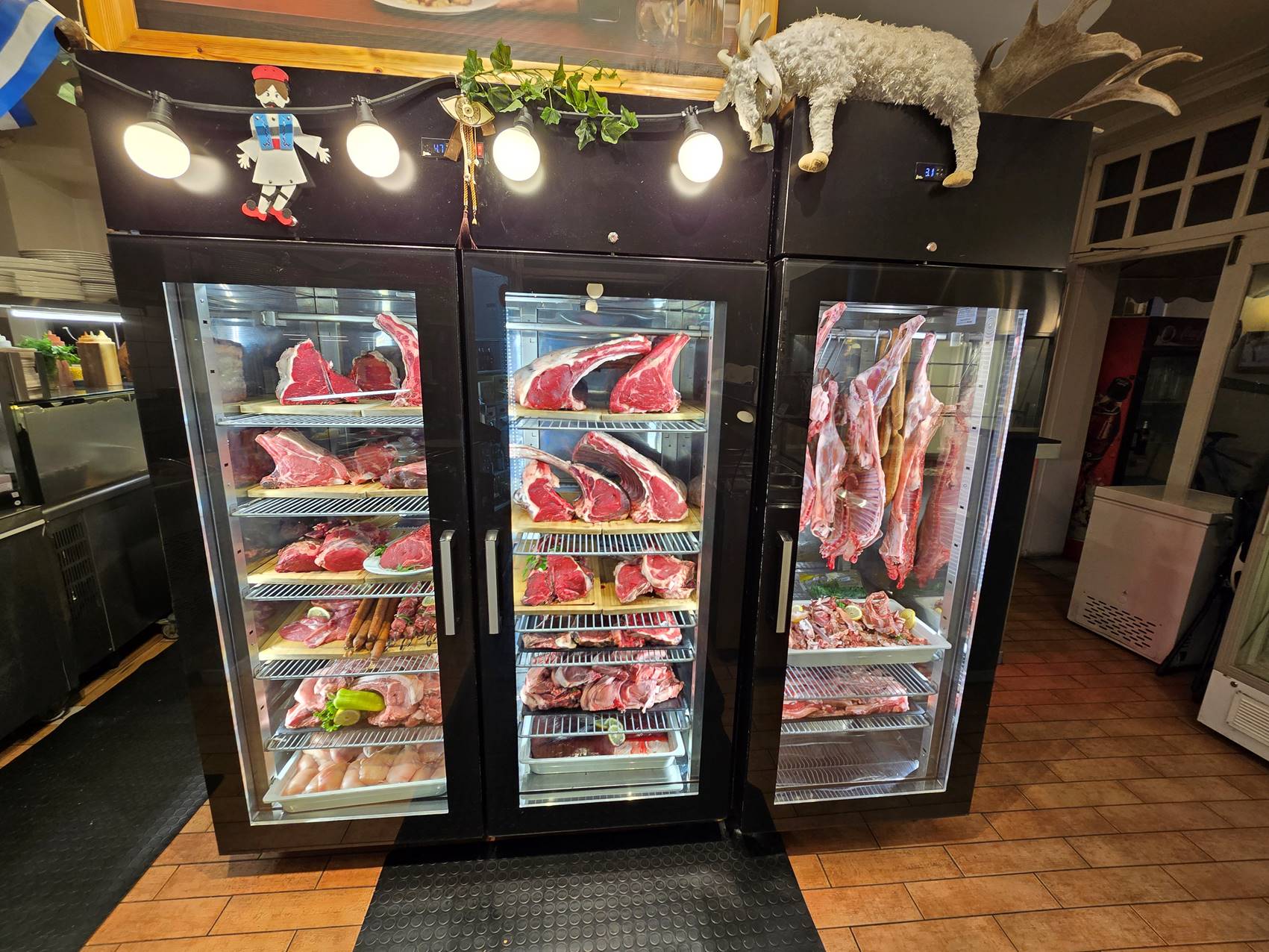 A display case with meat in it

Description automatically generated