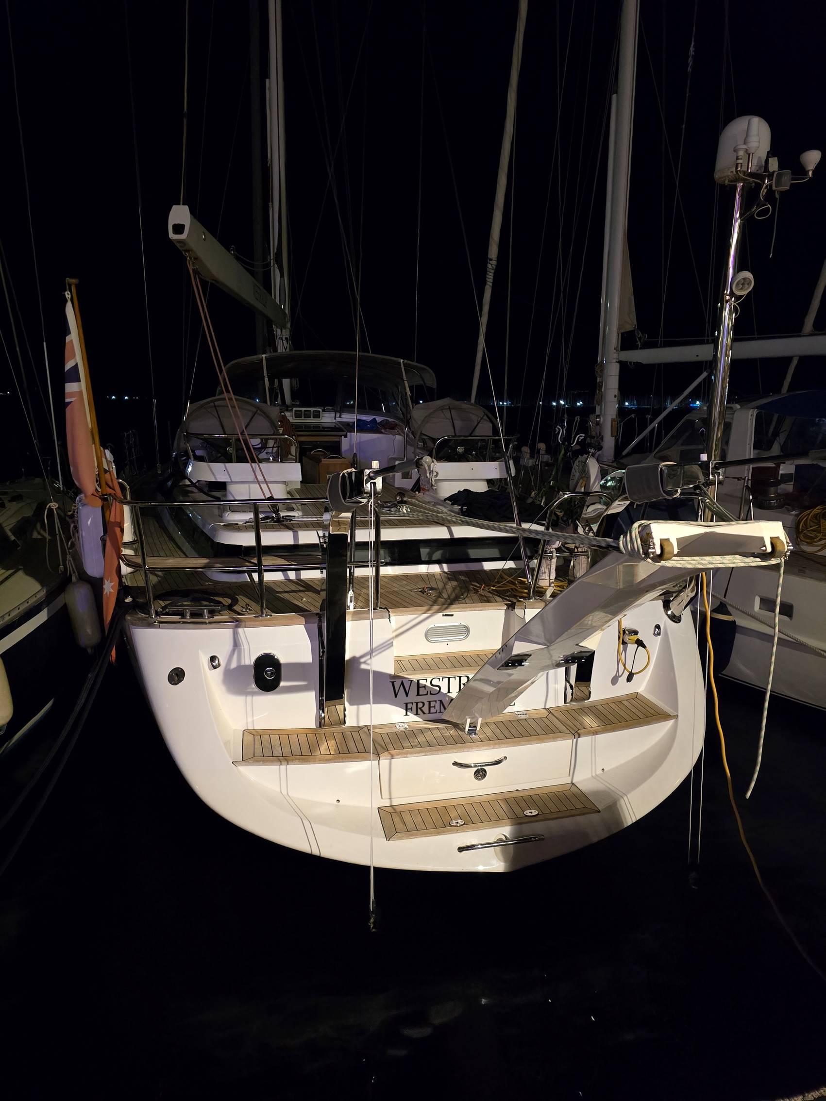 A white boat with a black background

Description automatically generated
