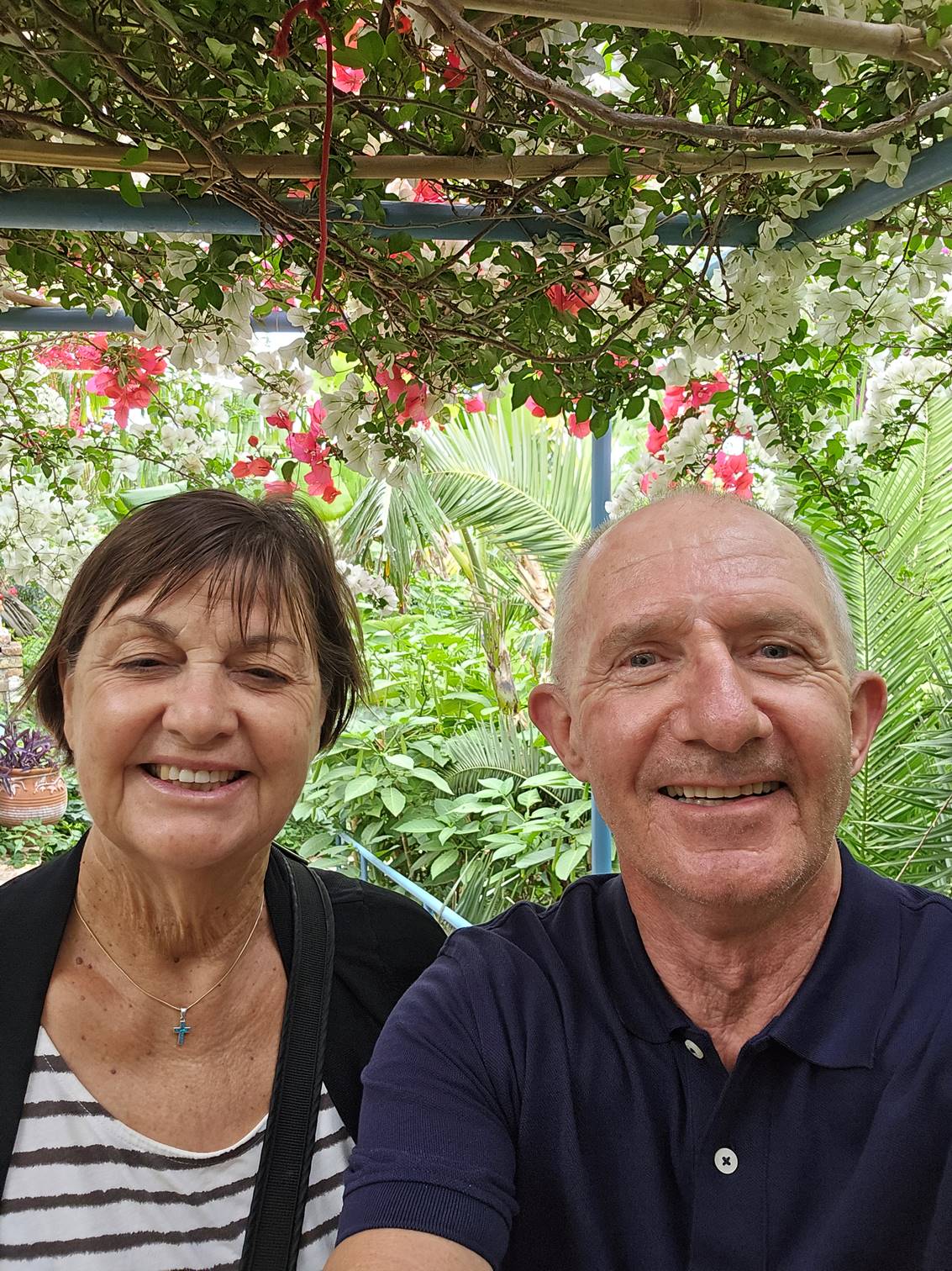 A person and person smiling for a picture

Description automatically generated