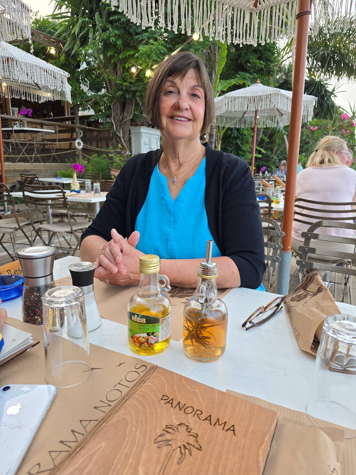 A person sitting at a table

Description automatically generated