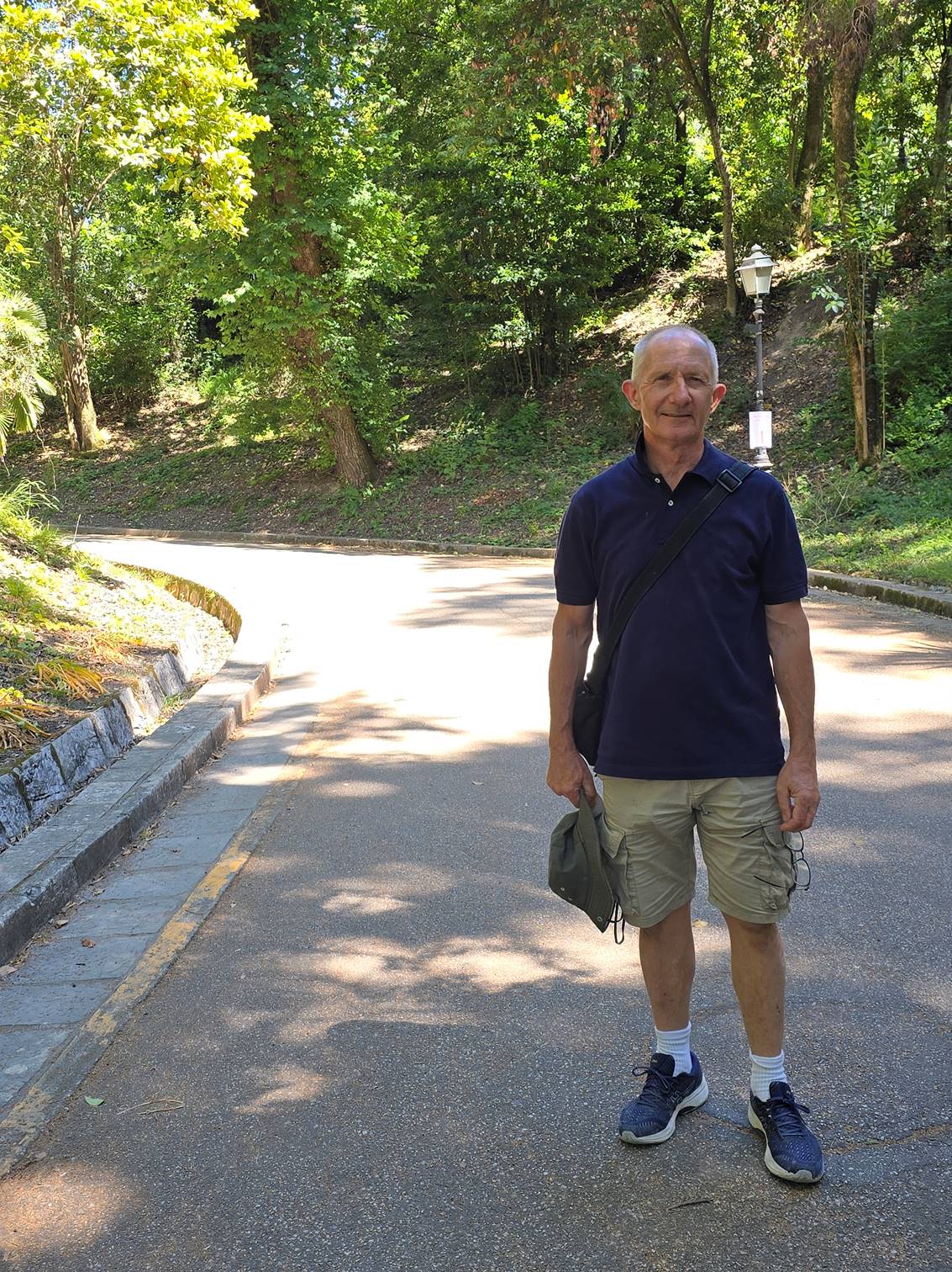 A person walking on a road

Description automatically generated