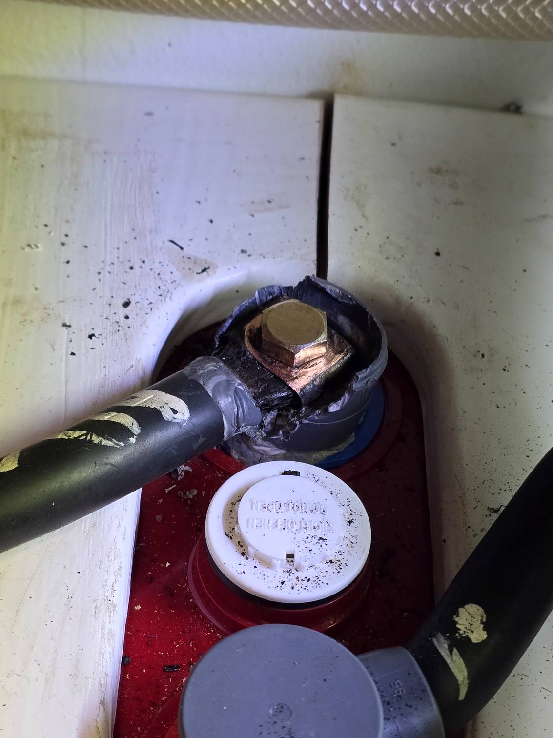 A close-up of a broken electrical cable

Description automatically generated