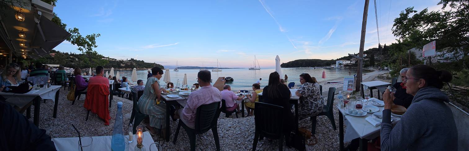 A group of people sitting at a table

Description automatically generated