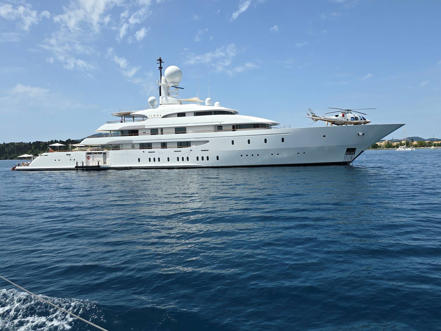 A large white yacht in the water

Description automatically generated