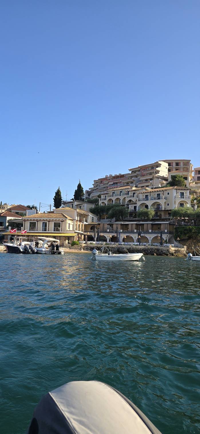 A body of water with buildings in the background

Description automatically generated