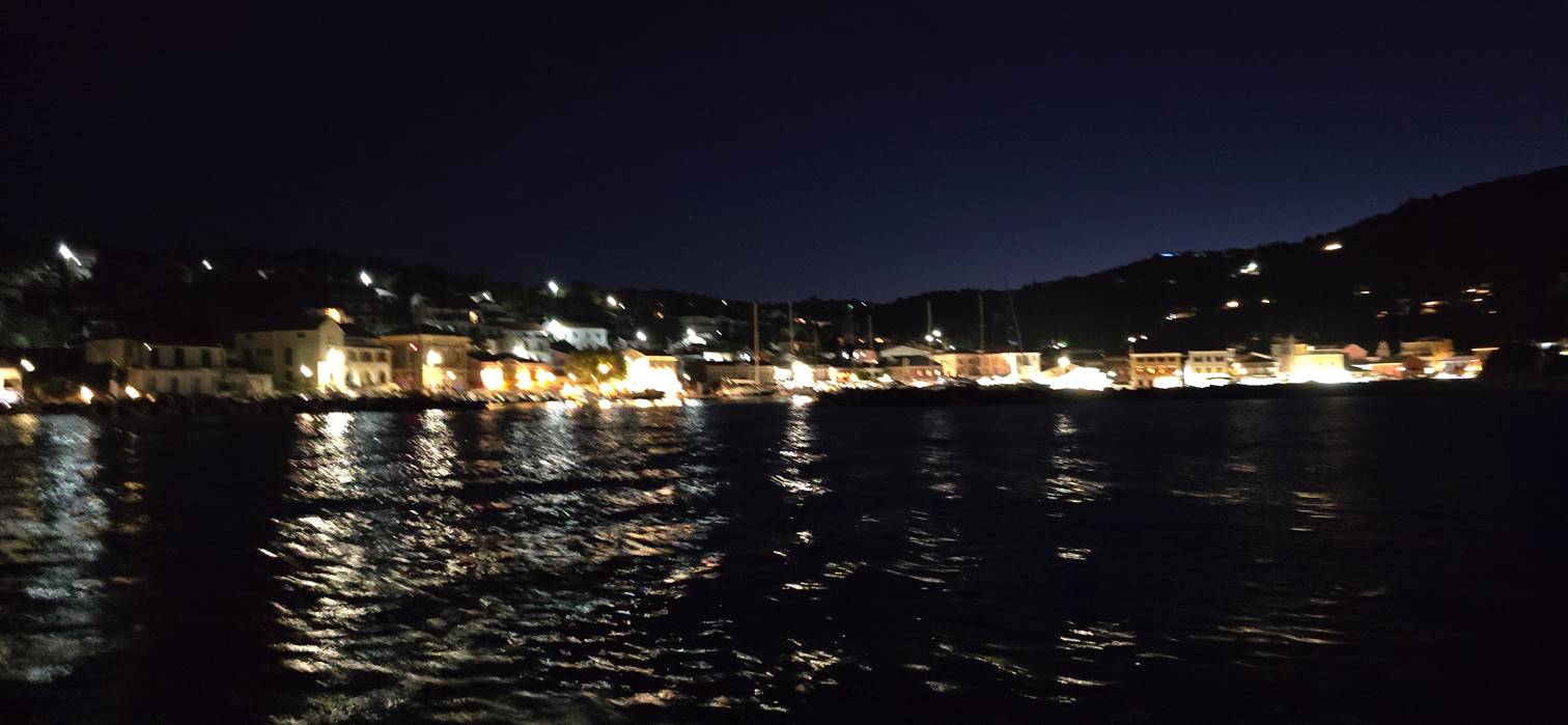 A city lights on the water

Description automatically generated