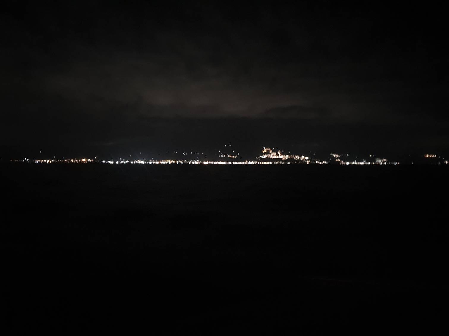 A city lights at night

Description automatically generated