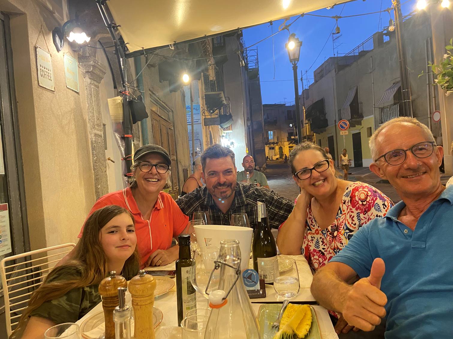 A group of people sitting at a table

Description automatically generated