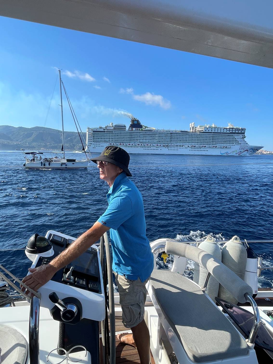 A person standing on a boat

Description automatically generated